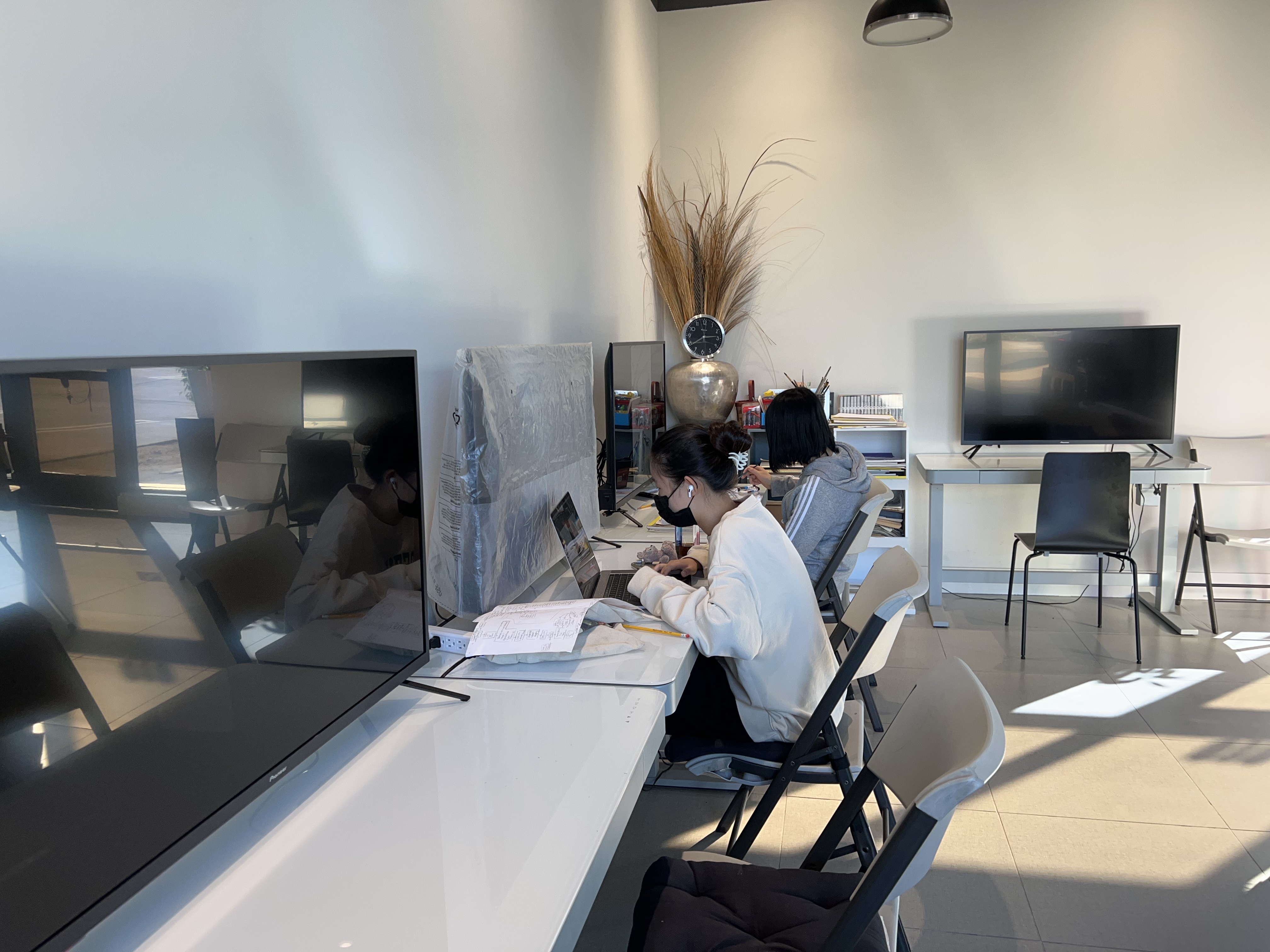Students working at computers inside the EXR Art Center studio